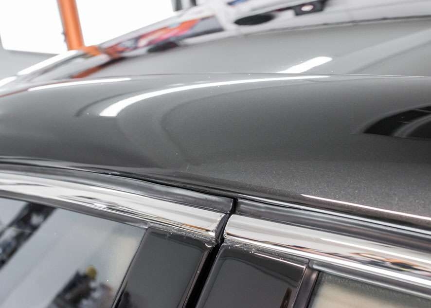 Close up shot of Bentley Flying Spur car after paint correction, paint correction and Paintwork Enhancement with no scratches